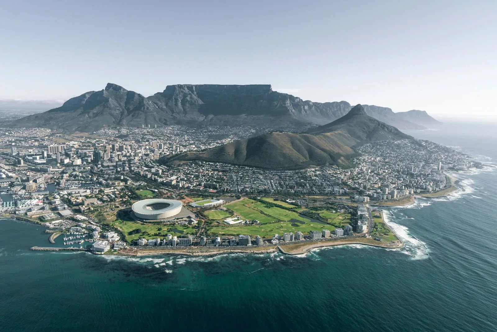 Aerial view of a modern African coastal city between mountains and the ocean
